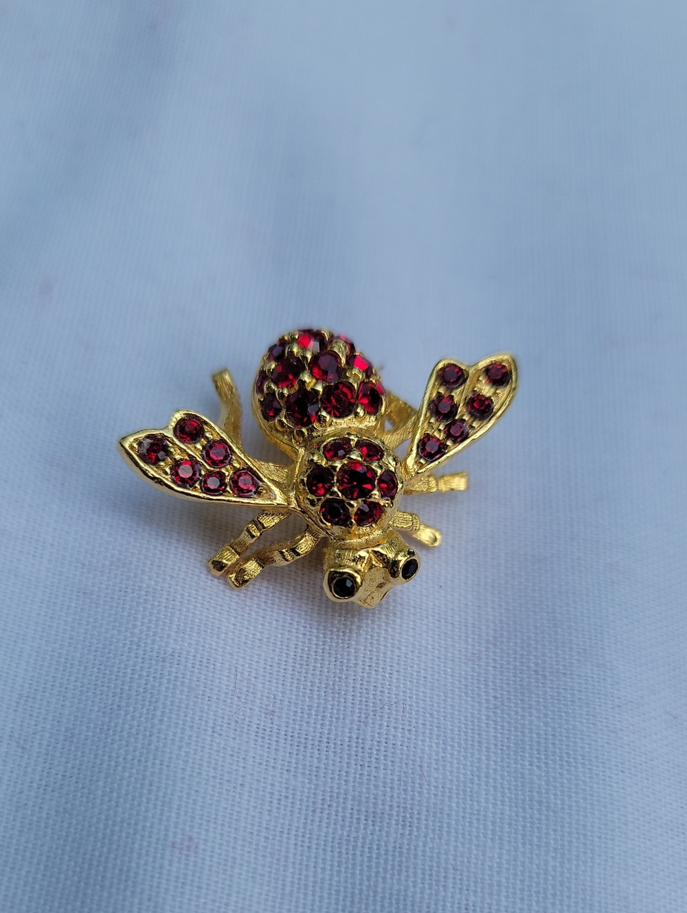 Vintage Joan Rivers Gold Bee Brooch with Red Crystals